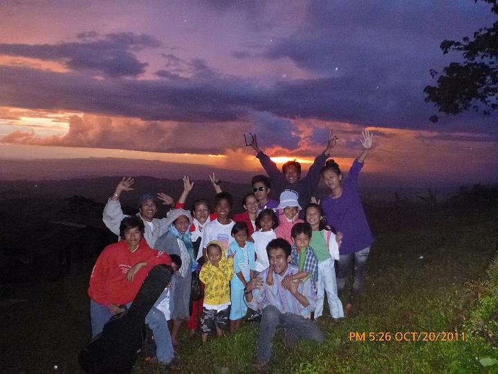 cheers while the sun sets