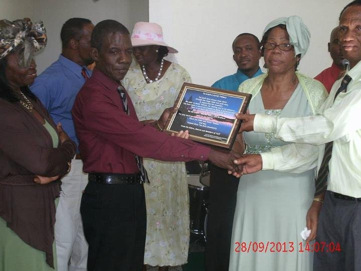 Elder Felix Thomas and his wife being honored