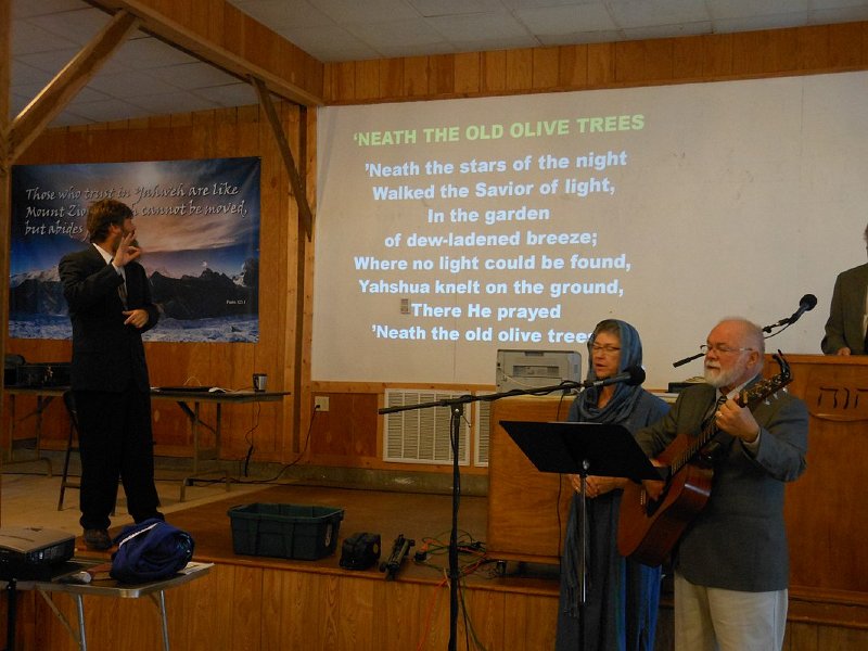 Brother Dewey Moore signing (ASL) the songs