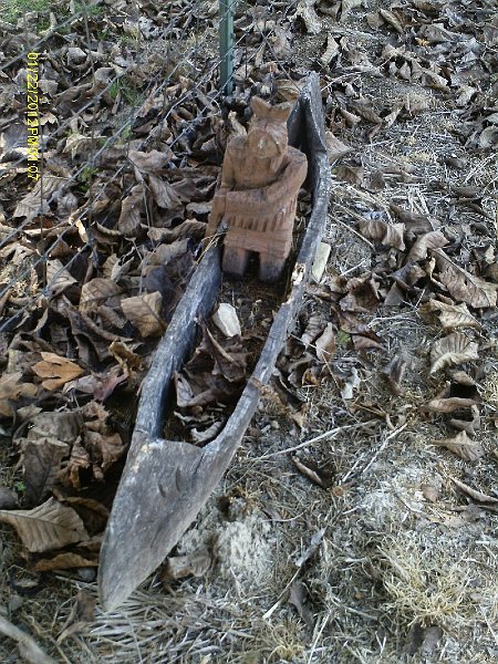 Indian in a canoe near the lake 1067x800