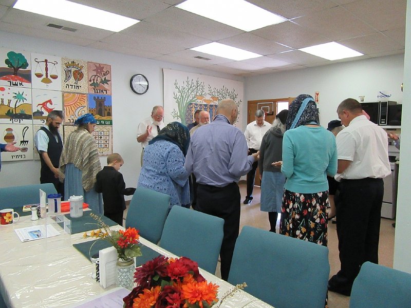 Elder John offering a Pray for the Fellowship Meal